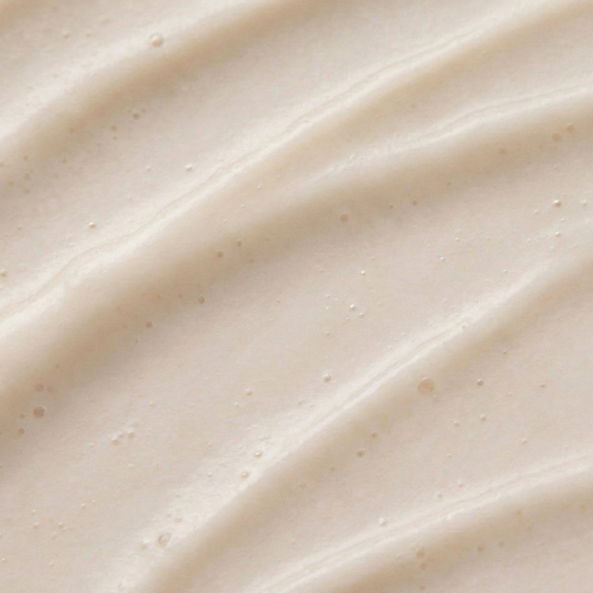 Close-up of smooth, beige cream texture
