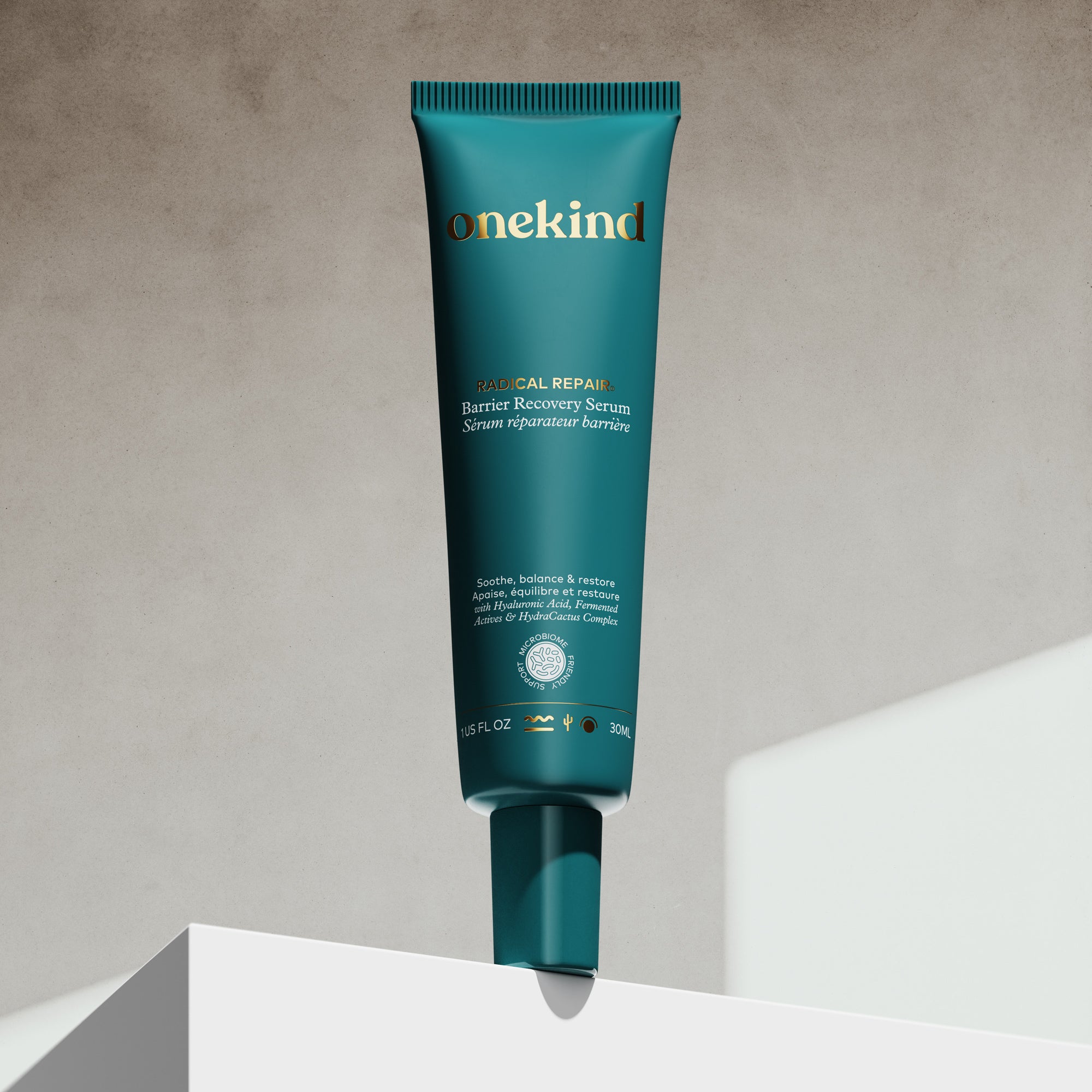 Onekind Barrier Recovery Serum tube on a gray background