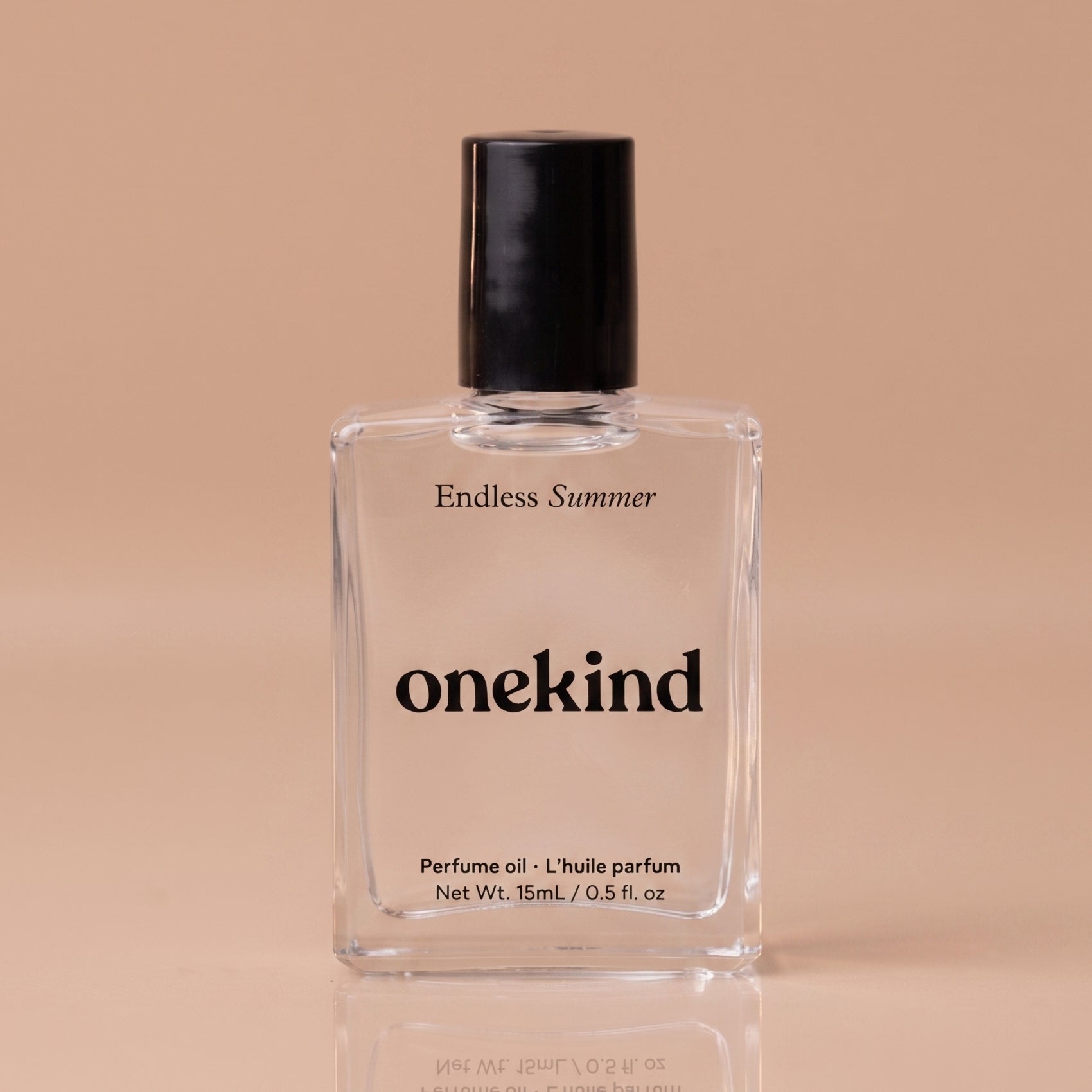 Perfume oil bottle labeled 'onekind Endless Summer' on a beige background