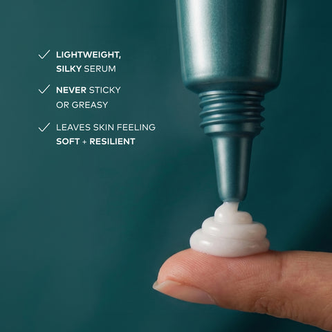 A close-up of a teal cosmetic serum tube dispensing a white cream onto a fingertip, with marketing text on the left reading 'LIGHTWEIGHT, SILKY SERUM', 'NEVER STICKY OR GREASY', and 'LEAVES SKIN FEELING SOFT + RESILIENT'.